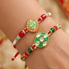 Peora Green Red Kundan Meenakari Rakhi for Brother | Set of 2