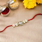 Oval CZ & Crystal Rakhi with Floral Grace