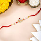Om Motif Rakhi in Beads & Crystal