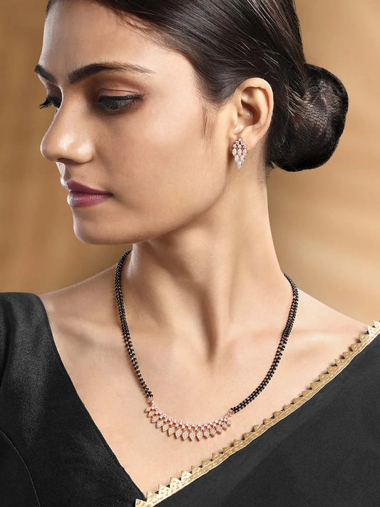 Stunning Radiant CZ Mangalsutra Set. Rose gold CZ mangalsutra set with black beads and matching earrings, in teardrop shape.