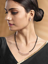 Stunning Radiant CZ Mangalsutra Set. Rose gold CZ mangalsutra set with black beads and matching earrings, in teardrop shape.