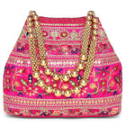 Rani Pink potli bag named Floral Threadwork Potli with Bead Handle, featuring artificial beads detailing and soft fabric texture | Peora
