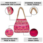 Rani Pink potli bag named Floral Threadwork Potli with Bead Handle, featuring artificial beads detailing and soft fabric texture | Peora

