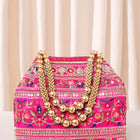 Rani Pink potli bag named Floral Threadwork Potli with Bead Handle, featuring artificial beads detailing and soft fabric texture | Peora
