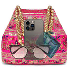 Rani Pink potli bag named Floral Threadwork Potli with Bead Handle, featuring artificial beads detailing and soft fabric texture | Peora

