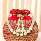 Red potli bag named Drawstring Potli with Zari Embroidery, featuring faux pearl detailing and soft fabric texture | Peora
