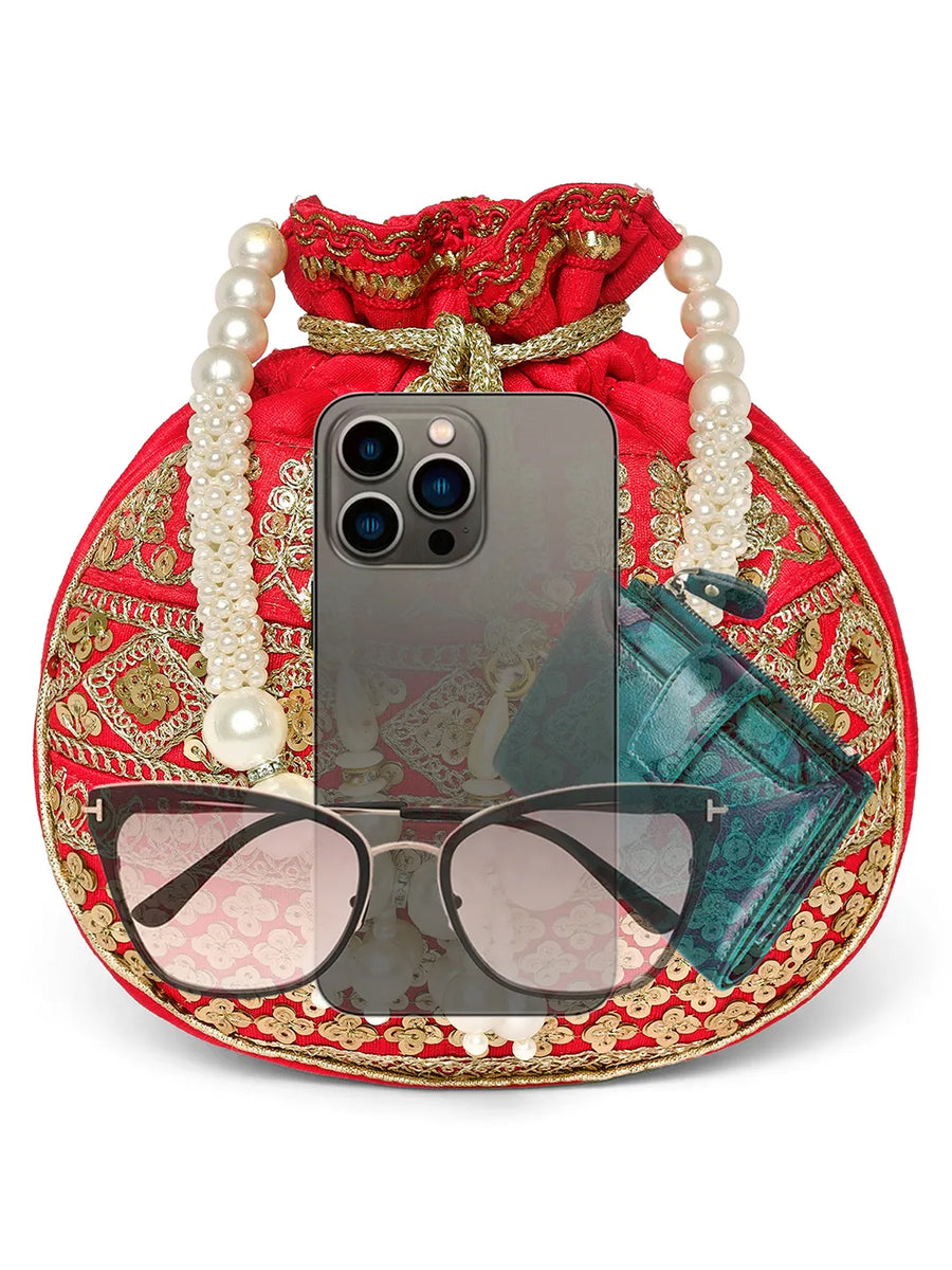 Red potli bag named Drawstring Potli with Zari Embroidery, featuring faux pearl detailing and soft fabric texture | Peora
