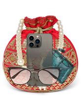 Red potli bag named Drawstring Potli with Zari Embroidery, featuring faux pearl detailing and soft fabric texture | Peora
