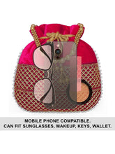 Red potli bag named Pearl Trim Zari Bead Potli Bag, featuring artificial beads detailing and soft fabric texture | Peora
