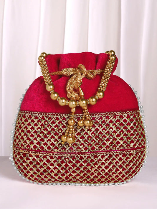 Red potli bag named Pearl Trim Zari Bead Potli Bag, featuring artificial beads detailing and soft fabric texture | Peora
