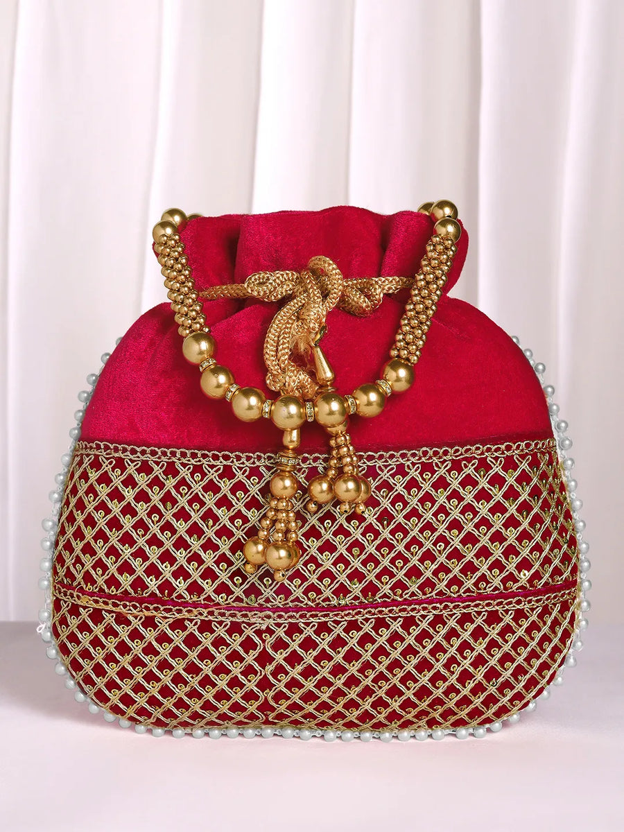Red potli bag named Pearl Trim Zari Bead Potli Bag, featuring artificial beads detailing and soft fabric texture | Peora
