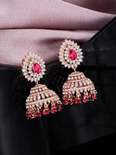 Luxurious Ruby & CZ Dangle Jhumki. A pair of Rose gold plating jhumka earrings with Cubic Zirconia Diamonds & Red rubies. Best for your elegant ethnic looks. 