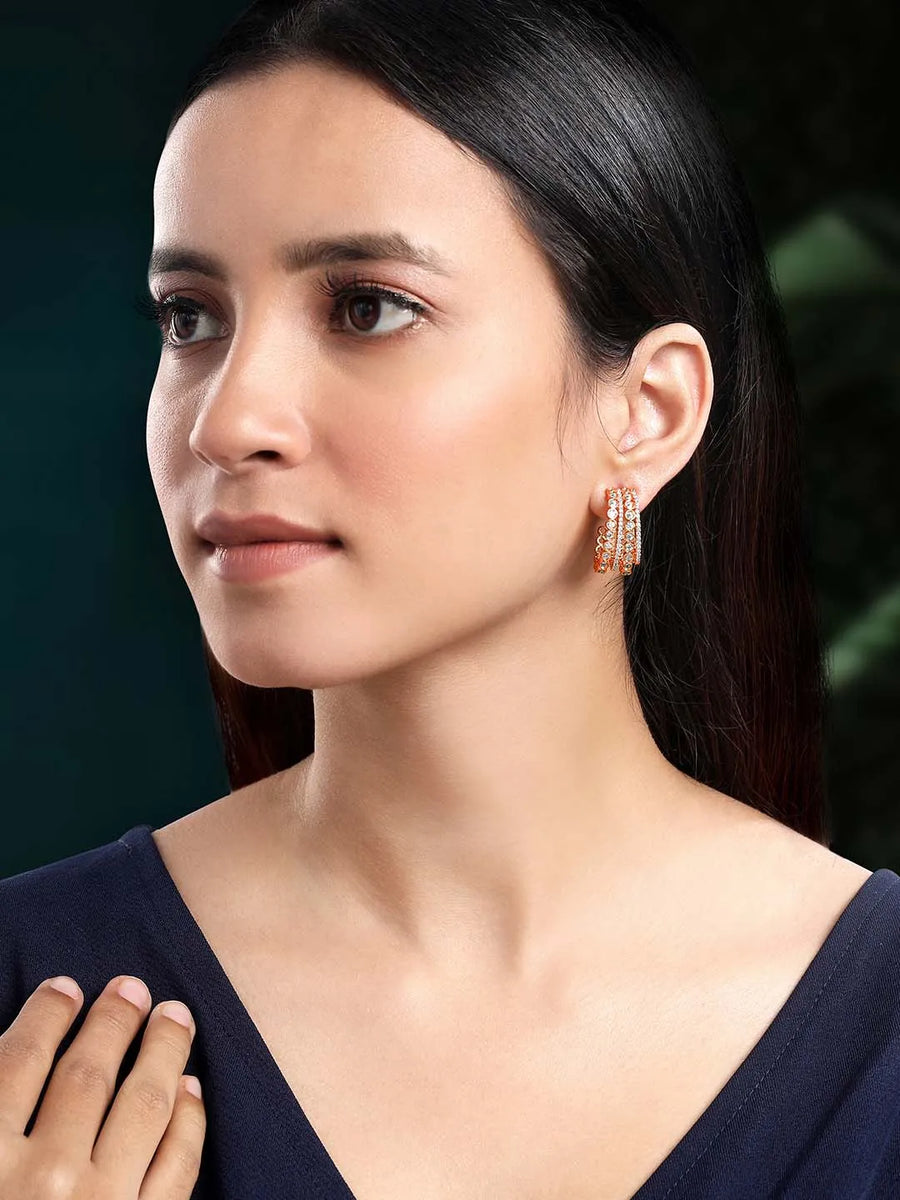 Glamorous Radiant CZ Half Hoop Earrings. A pair of rose gold-colored half hoop earrings with cubic zirconia embellishments. Ideal for casuals & party looks.