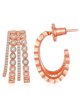 Glamorous Radiant CZ Half Hoop Earrings. A pair of rose gold-colored half hoop earrings with cubic zirconia embellishments. Ideal for casuals & party looks.