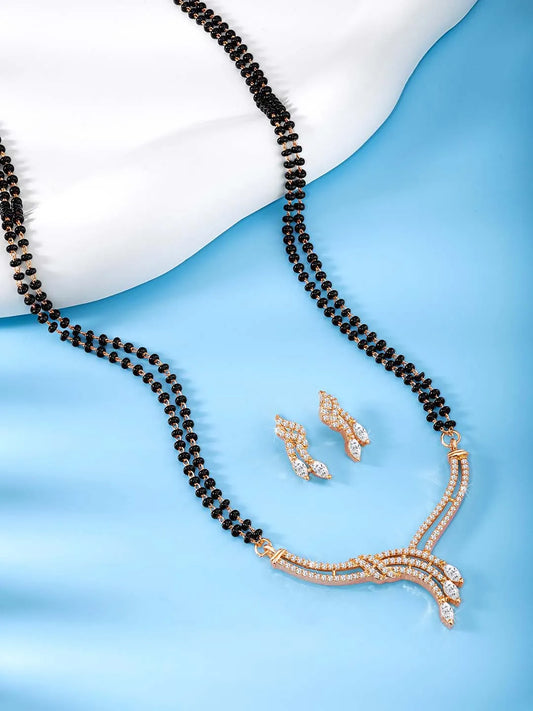 Brilliant Dazzling CZ Mangalsutra Set. Rose gold CZ mangalsutra set with black beads and matching earrings
