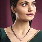 Brilliant Dazzling CZ Mangalsutra Set. Rose gold CZ mangalsutra set with black beads and matching earrings