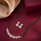 Luxurious Gleaming CZ Mangalsutra Set. Mangalsutra and matching earrings with cubic zirconia stones along with rose gold plating.