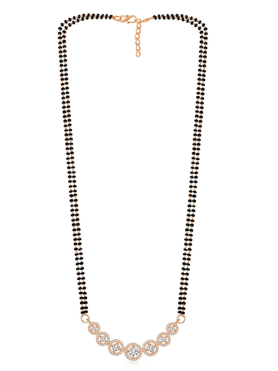 Luxurious Gleaming CZ Mangalsutra Set. Mangalsutra and matching earrings with cubic zirconia stones along with rose gold plating.
