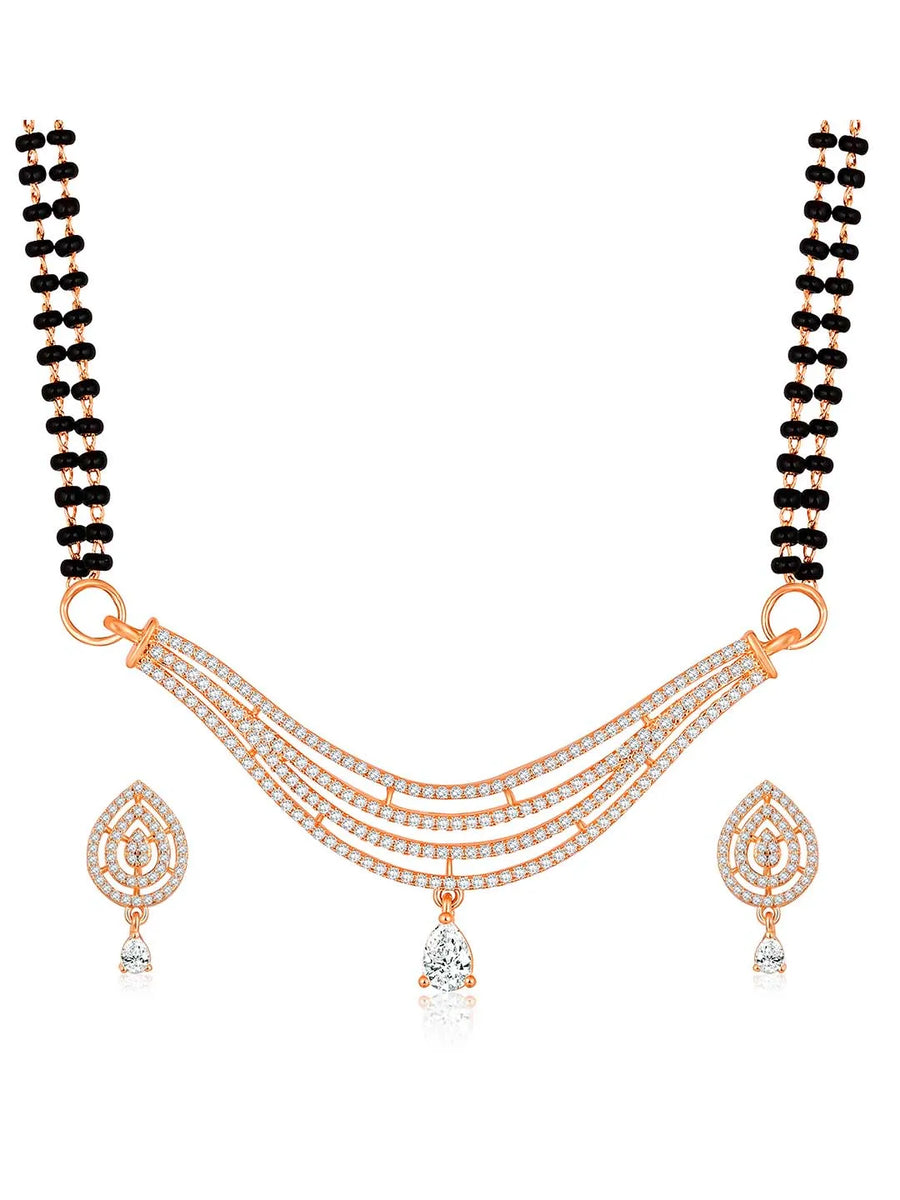 CZ Studded Traditional Mangalsutra Set. A traditional mangalsutra set with black beads and rose gold-color plating, zirconia stones, & matching earrings.