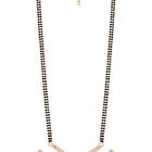 CZ Studded Traditional Mangalsutra Set. A traditional mangalsutra set with black beads and rose gold-color plating, zirconia stones, & matching earrings.