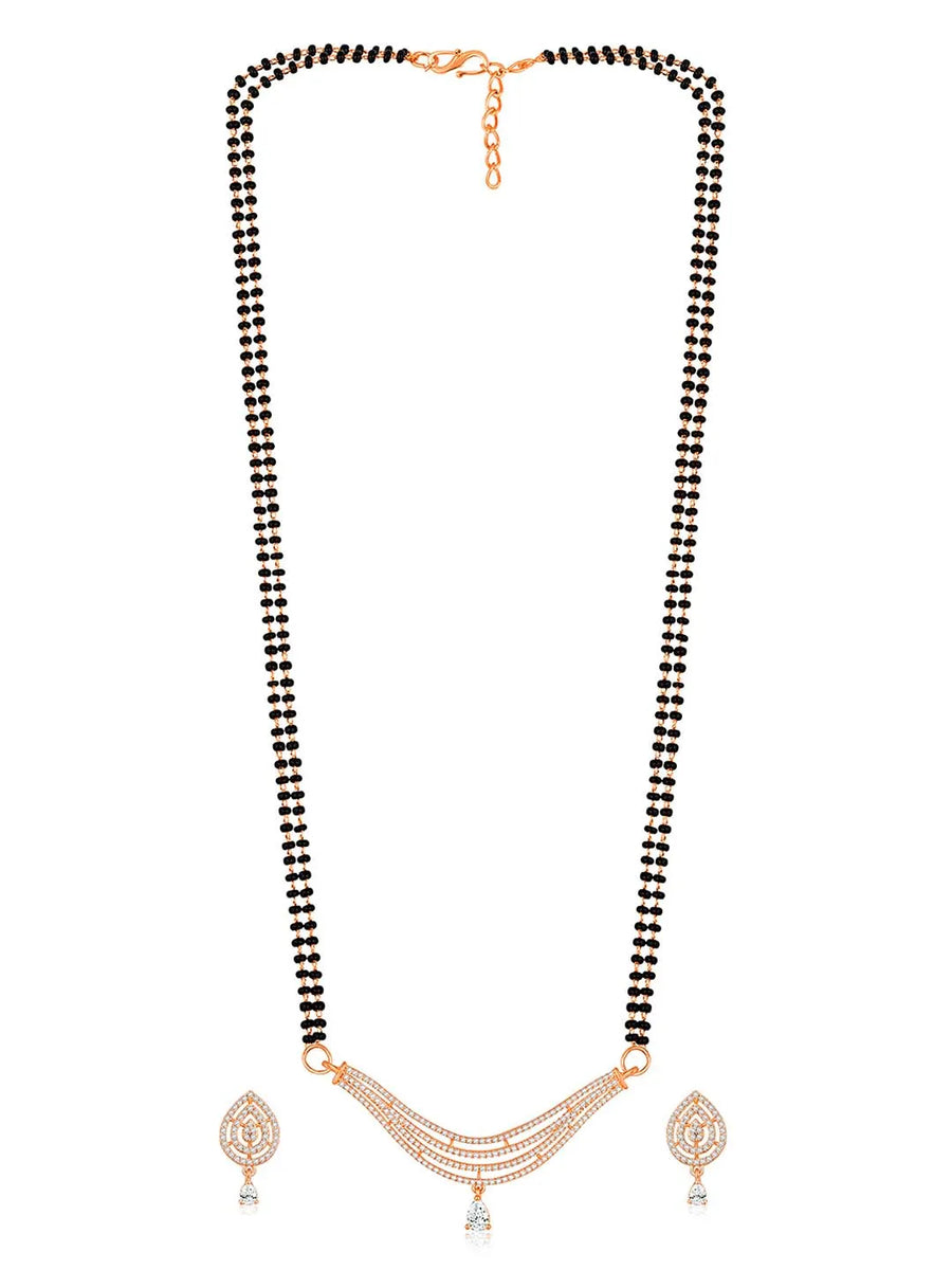 CZ Studded Traditional Mangalsutra Set. A traditional mangalsutra set with black beads and rose gold-color plating, zirconia stones, & matching earrings.