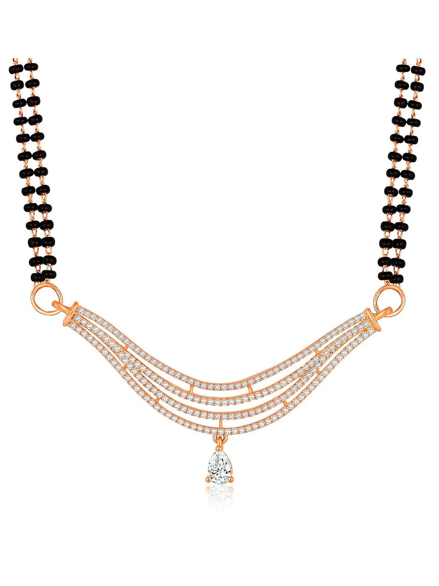 CZ Studded Traditional Mangalsutra Set. A traditional mangalsutra set with black beads and rose gold-color plating, zirconia stones, & matching earrings.