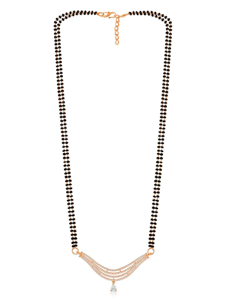 CZ Studded Traditional Mangalsutra Set. A traditional mangalsutra set with black beads and rose gold-color plating, zirconia stones, & matching earrings.