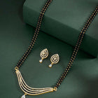 CZ Studded Traditional Mangalsutra Set. A traditional mangalsutra set with black beads and gold-color plating, zirconia stones, & matching earrings.