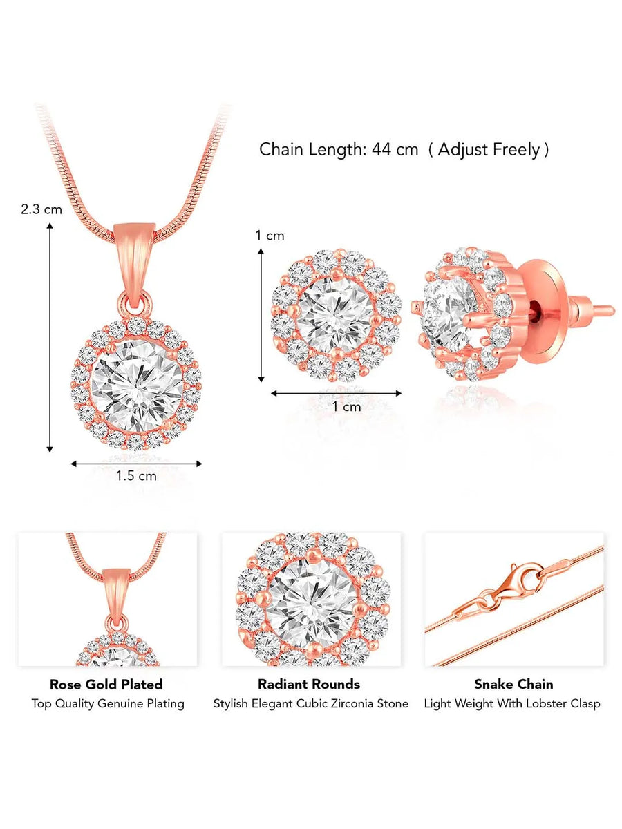 A rose gold-colored pendant necklace with a round cubic zirconia solitaire pendant accompanied by a pair of matching earrings, displayed on a pink cushion.