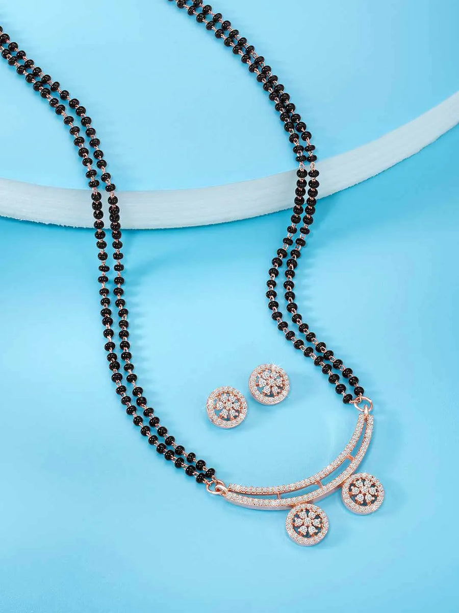 Stunning Dazzling CZ Mangalsutra Set. A set of CZ Mangalsutra jewellery and earrings, with rose gold-colour plating and black beads.