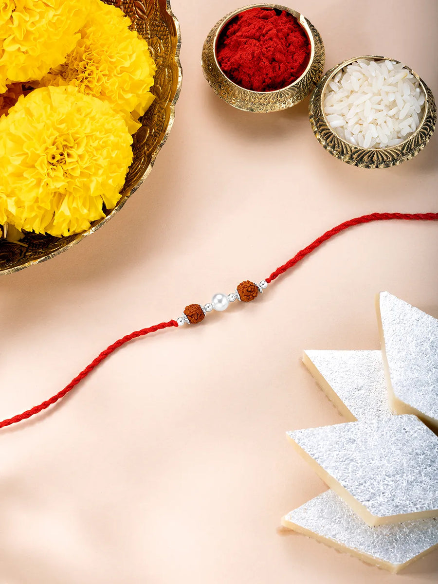 Close-up of Silver Tied Rudraksh Rakhi Thread featuring red thread, beads work, and rhodium plating – ideal for Raksha Bandhan | Peora

