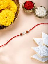 Close-up of Silver Tied Rudraksh Rakhi Thread featuring red thread, beads work, and rhodium plating – ideal for Raksha Bandhan | Peora
