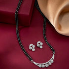 Sparkling CZ Wedding Mangalsutra. A set of sparkling CZ wedding mangalsutra, with earrings, silver colour and cubic zirconia stones.