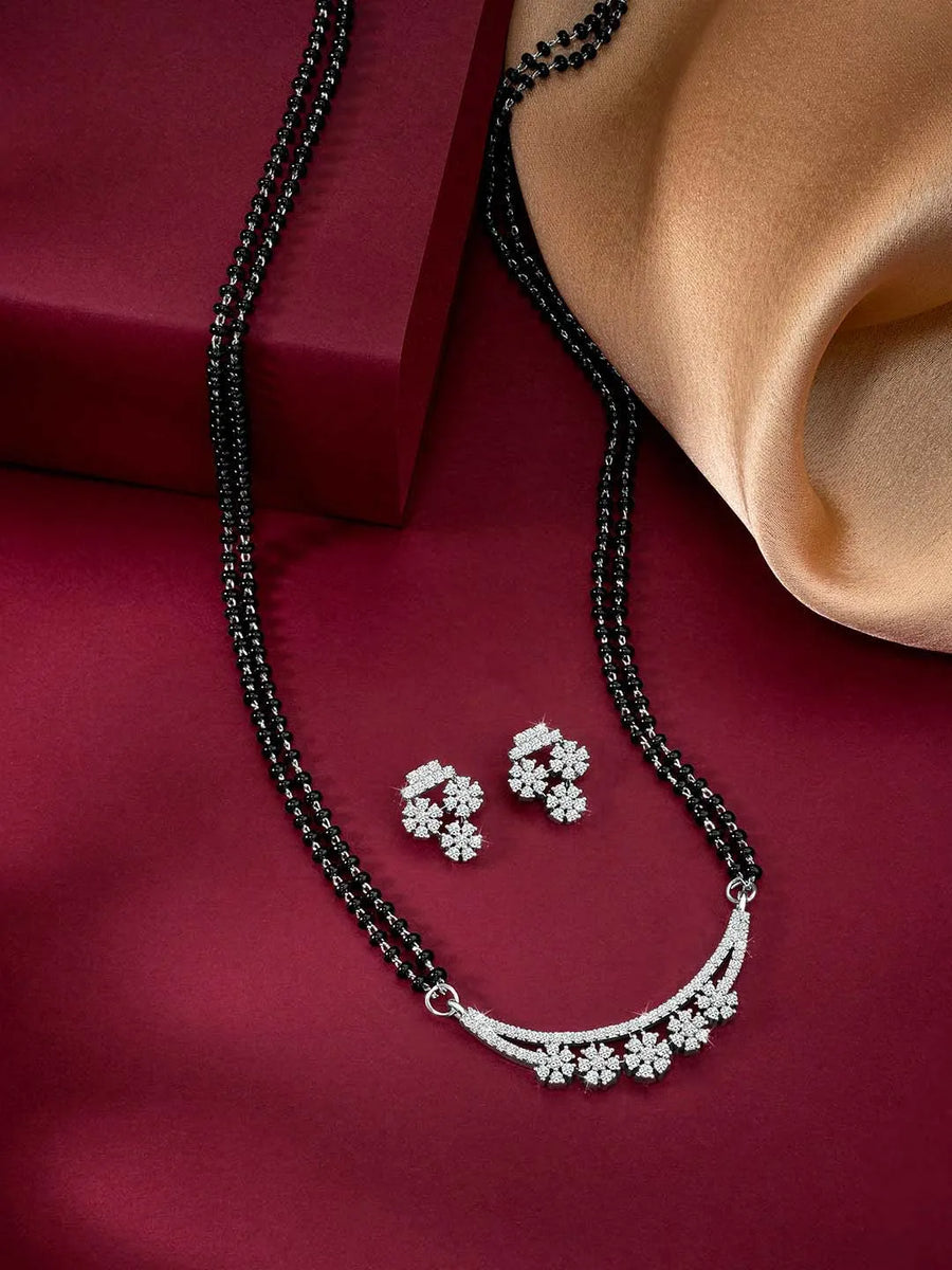 Sparkling CZ Wedding Mangalsutra. A set of sparkling CZ wedding mangalsutra, with earrings, silver colour and cubic zirconia stones.