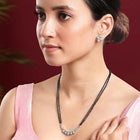 Sparkling CZ Wedding Mangalsutra. A set of sparkling CZ wedding mangalsutra, with earrings, silver colour and cubic zirconia stones.