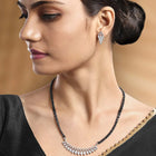 Stunning Radiant CZ Mangalsutra Set. Silver CZ mangalsutra set with black beads and matching earrings, in teardrop shape.