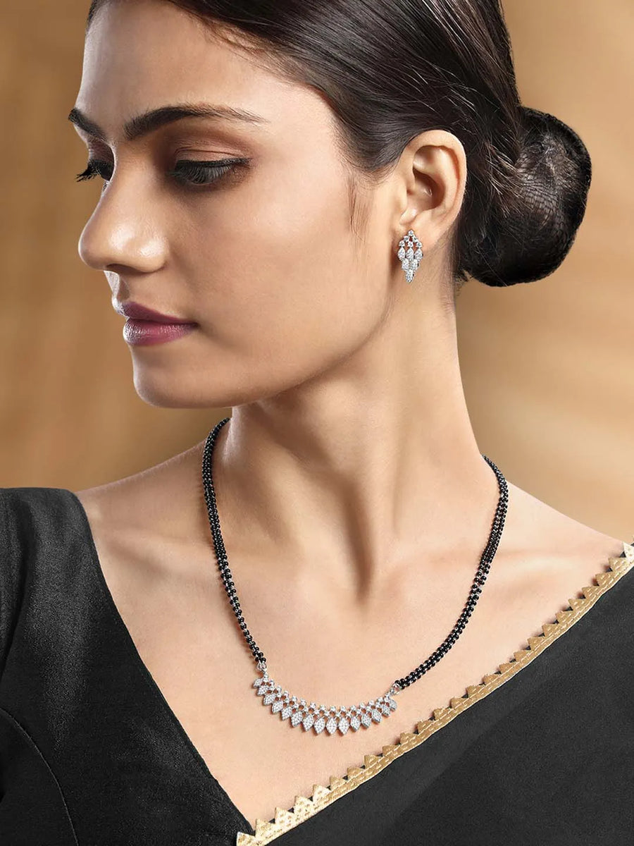 Stunning Radiant CZ Mangalsutra Set. Silver CZ mangalsutra set with black beads and matching earrings, in teardrop shape.