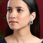 Dewdrop CZ &Crystal Stone Earrings.  Silver-plated earrings featuring a teardrop-shaped green cubic zirconia stone with pearls.