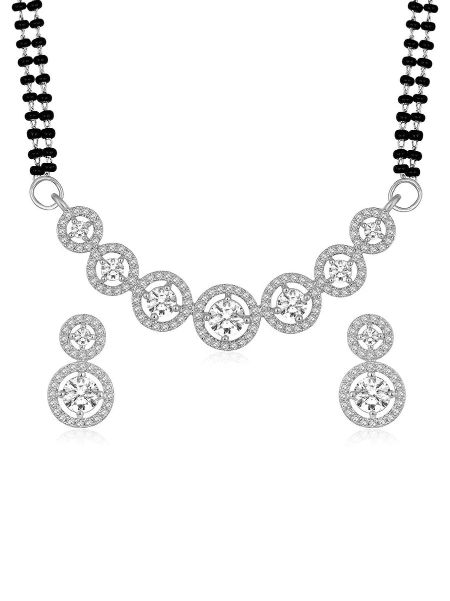 Luxurious Gleaming CZ Mangalsutra Set. Mangalsutra and matching earrings with cubic zirconia stones along with silver plating.