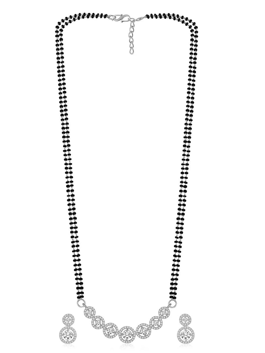 Luxurious Gleaming CZ Mangalsutra Set. Mangalsutra and matching earrings with cubic zirconia stones along with silver plating.