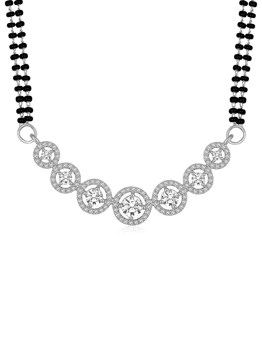 Luxurious Gleaming CZ Mangalsutra Set. Mangalsutra and matching earrings with cubic zirconia stones along with silver plating.