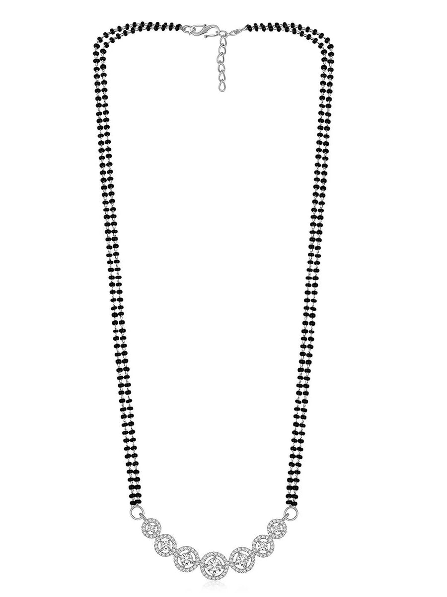 Luxurious Gleaming CZ Mangalsutra Set. Mangalsutra and matching earrings with cubic zirconia stones along with silver plating.