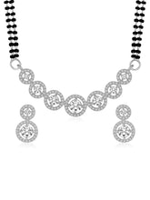 Luxurious Gleaming CZ Mangalsutra Set. Mangalsutra and matching earrings with cubic zirconia stones along with silver plating.