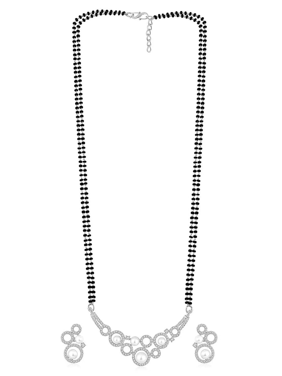 Beautiful Shimmering CZ Mangalsutra Set. A set of black beaded Mangalsutra with silver-colour and geometric patterns, with pearls, CZ stones.