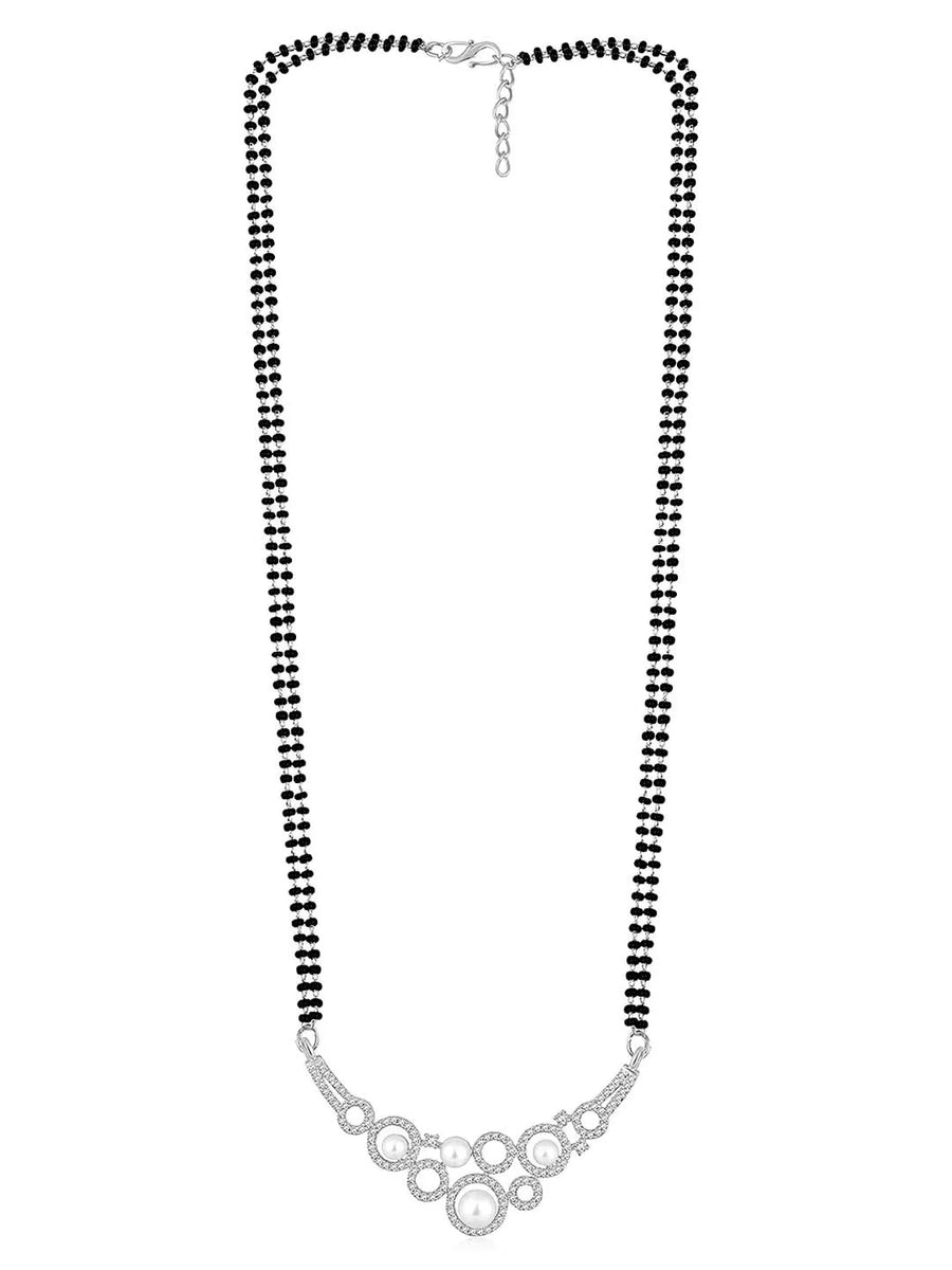 Beautiful Shimmering CZ Mangalsutra Set. A set of black beaded Mangalsutra with silver-colour and geometric patterns, with pearls, CZ stones.