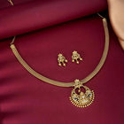 Radiant Elegance Golden Necklace Set. A golden necklace set with intricate designs, consisting of necklace and matching earrings.