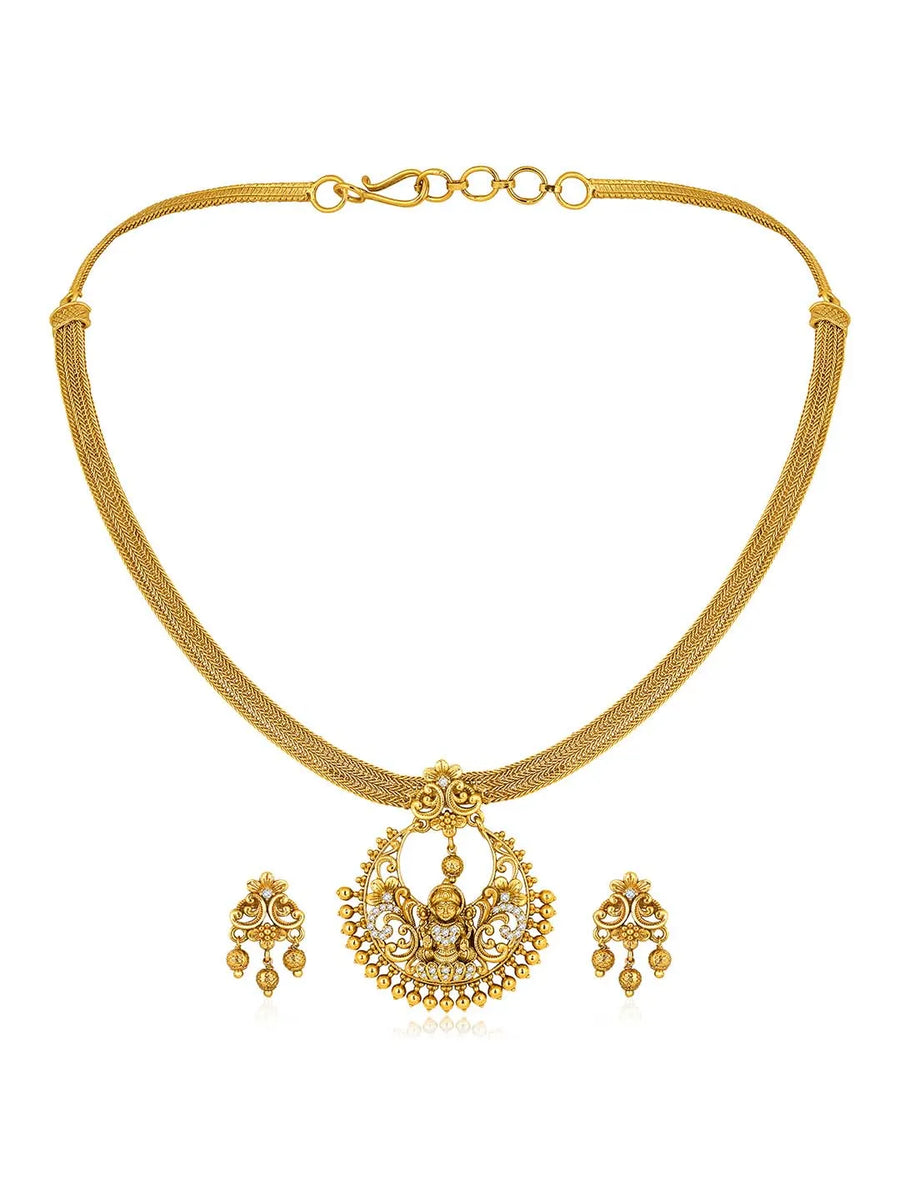Radiant Elegance Golden Necklace Set. A golden necklace set with intricate designs, consisting of necklace and matching earrings.