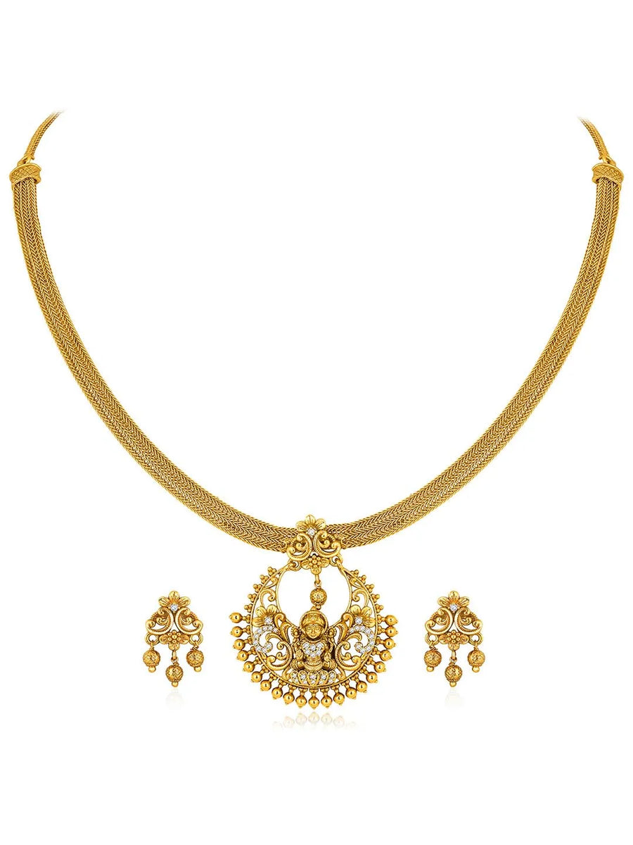 Radiant Elegance Golden Necklace Set. A golden necklace set with intricate designs, consisting of necklace and matching earrings.