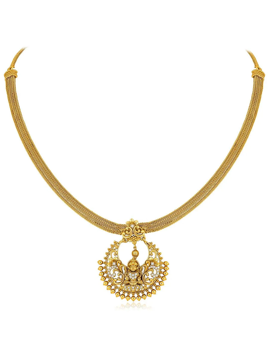 Radiant Elegance Golden Necklace Set. A golden necklace set with intricate designs, consisting of necklace and matching earrings.
