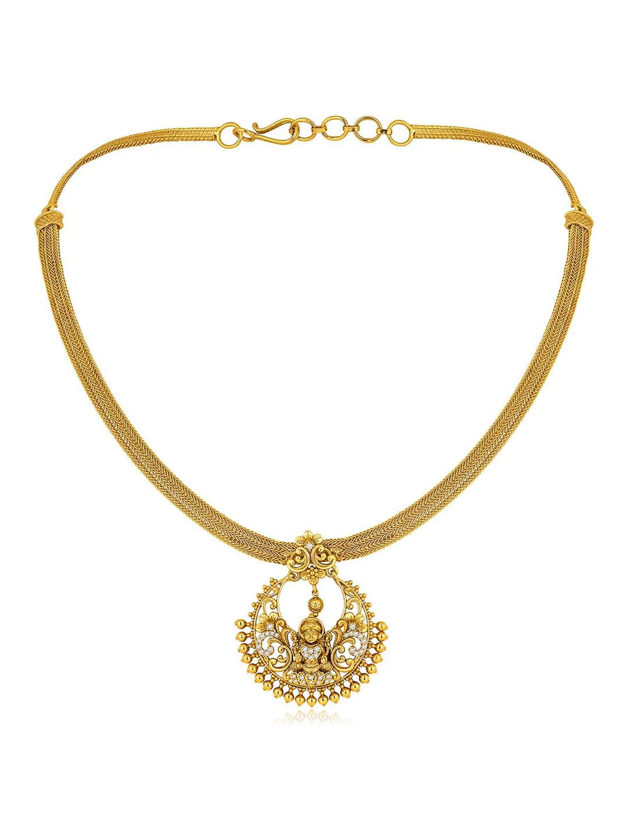 Radiant Elegance Golden Necklace Set. A golden necklace set with intricate designs, consisting of necklace and matching earrings.